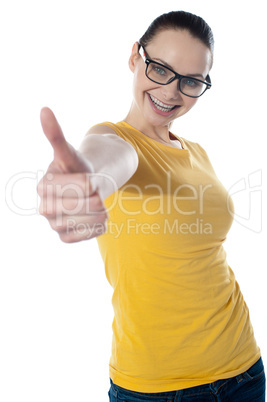 Pretty teenager showing thumbs-up