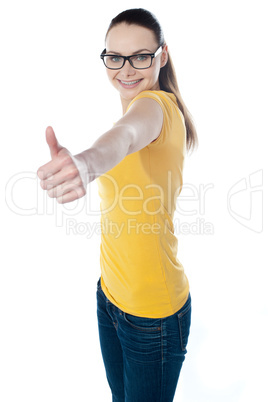 Glamourous teenager gesturing thumbs-up