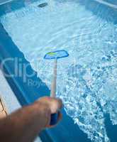 Man with Pool Skimmer