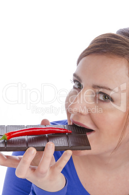 Woman with red paprika and chocolate