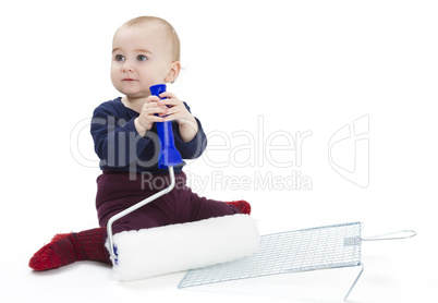 young child with painters equipment