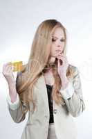 young blonde girl with a golden credit card
