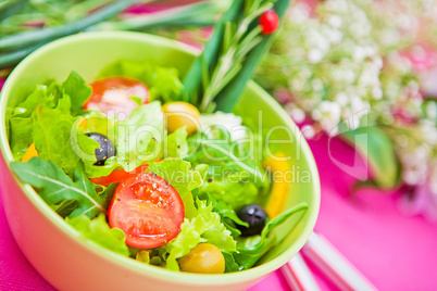 bowl with a salad on the table