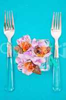 flowers in a glass dish with slices of fish