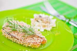 fish with sesame on a green plate