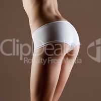 Beauty and perfect woman with ideal fitness body in white pantie