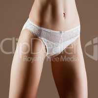 Beauty and perfect woman with ideal fitness body in white pantie