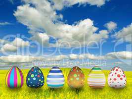 many color easter eggs over blue sky background