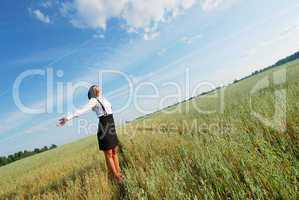 Attractive happy young woman in the field