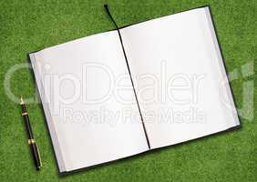 Blank book on grass