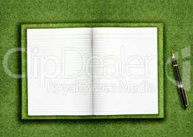 Blank book on grass