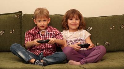 boy and little girl play video game