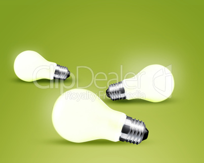 Three glowing Light bulb idea on green background