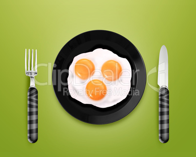 Three fried eggs on a Plate