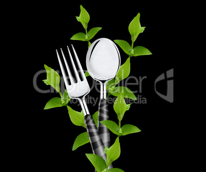 green leaves around fork and spoon