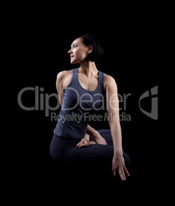 Beautiful yong woman sit in dark - yoga asana