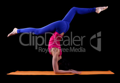 Woman exercise yoga asana - arm balance