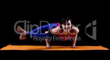 Woman exercise yoga asana - arm balance
