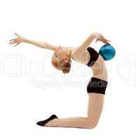 Young woman in black posing with gymnastic ball