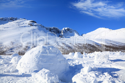 igloo on the background of mountains