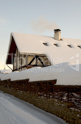 Winter country building under the snow