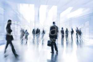 business people in motion blur
