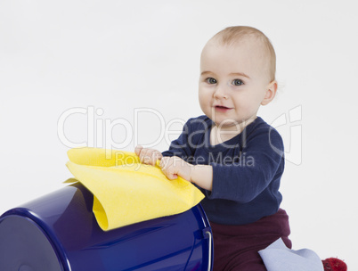 toddler with bucket and floor cloth