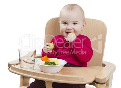 young child eating in high chair