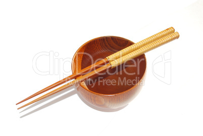 Chopsticks with wooden bowl isolated on white