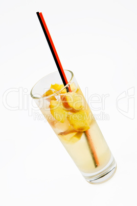 A delicious cocktail with apple slices in a glass beaker with tw