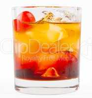 A delicious glass of whiskey with ice cubes and cherry