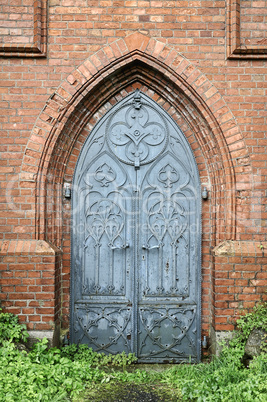 Old gothic church metal door