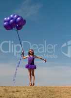 Pretty little girl with baloons in hand