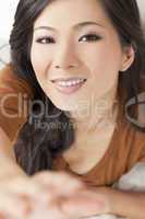 Beautiful Young Asian Chinese Woman Reaching To Camera
