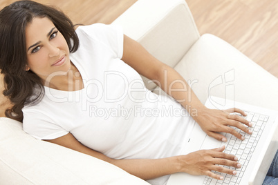 Happy Hispanic Woman Using Laptop Computer