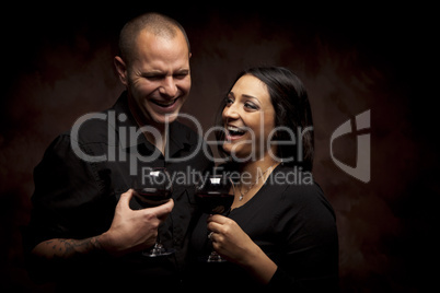 Happy Mixed Race Couple Holding Wine Glasses