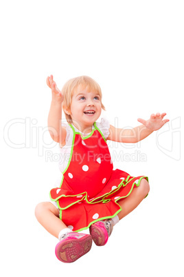 Cheerful little girl in red apron