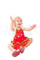 Cheerful little girl in red apron