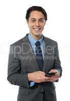 Handsome businessman using a smartphone