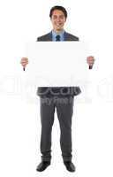 Young businessman holds the blank billboard