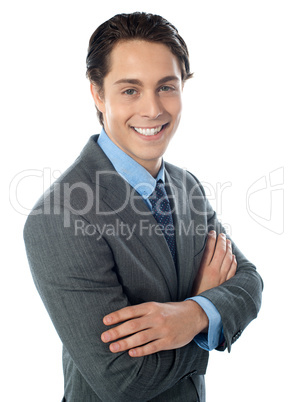 Charming young businessman posing in style