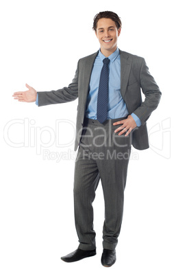 Successful businessman presenting over white background