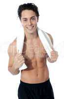 Handsome muscular man with the towel