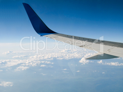 Airplane Flying above the Clouds