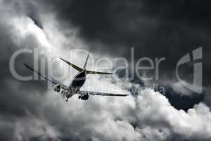 Passenger jet landing against a stormy sky