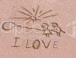 Inscription on sand I love