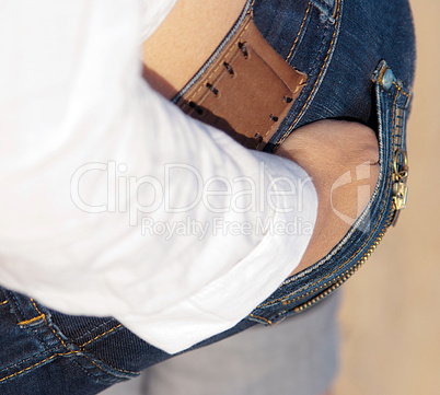 standing backwards woman with hand in pocket