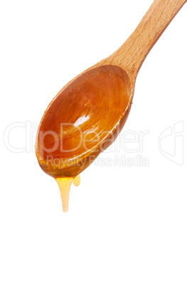 wooden spoon with honey isolated