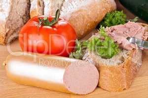 breakfast or lunch with mixed vegetables, sausage and a knife