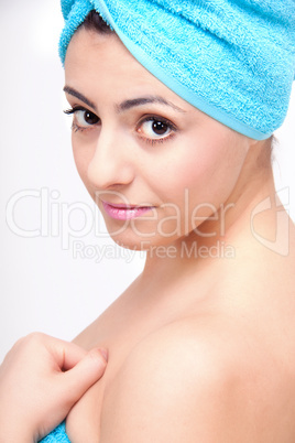 young beautiful woman with a towel doing wellness